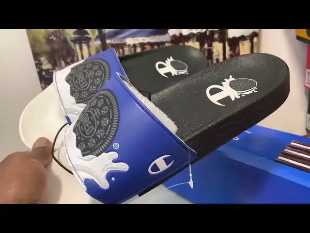 'Video thumbnail for Quick Look At The Champion Oreo Black Blue & White Slides & Where To Buy It'