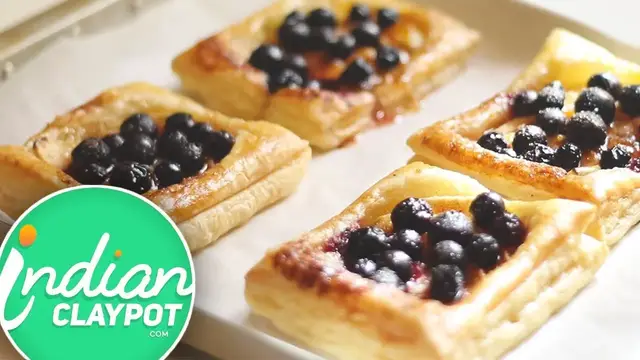'Video thumbnail for Crispy Blueberry Puff Pastry Tarts Recipe - The Indian Claypot'