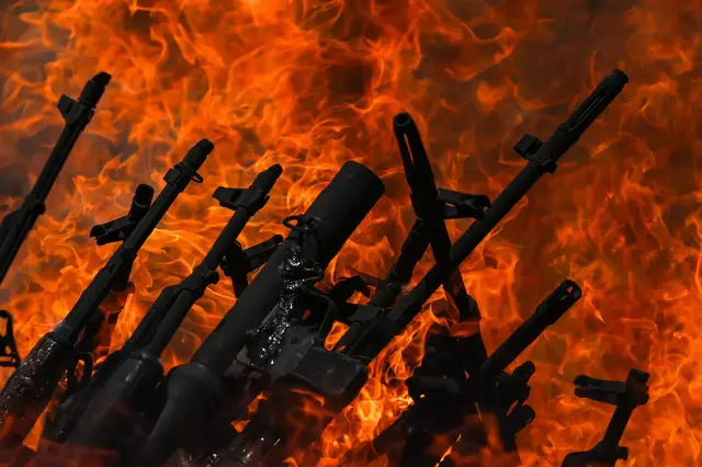 'Video thumbnail for PKK fighters cast weapons into fire to mark start of disarmament'