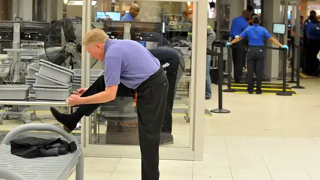 'Video thumbnail for Passengers no longer have to remove shoes at US airport screening'