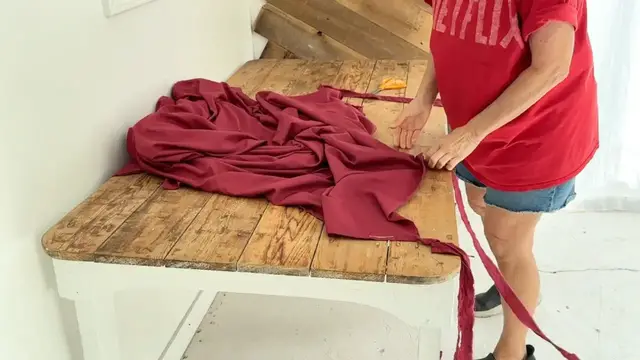 'Video thumbnail for She rips up a red bedsheet for this BRILLIANT porch idea!'