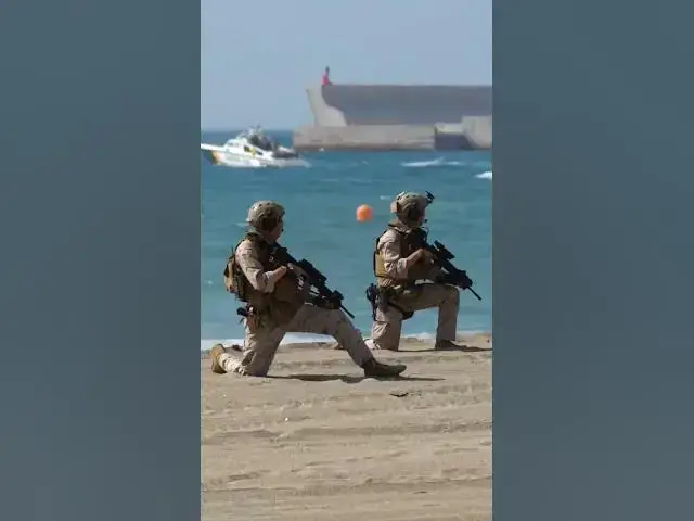 'Video thumbnail for Spanish navy storms Malaga beach in front of astonished tourists'