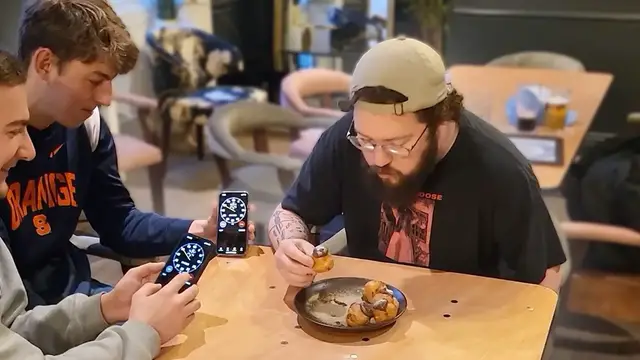 'Video thumbnail for Most profiteroles eaten in one minute'