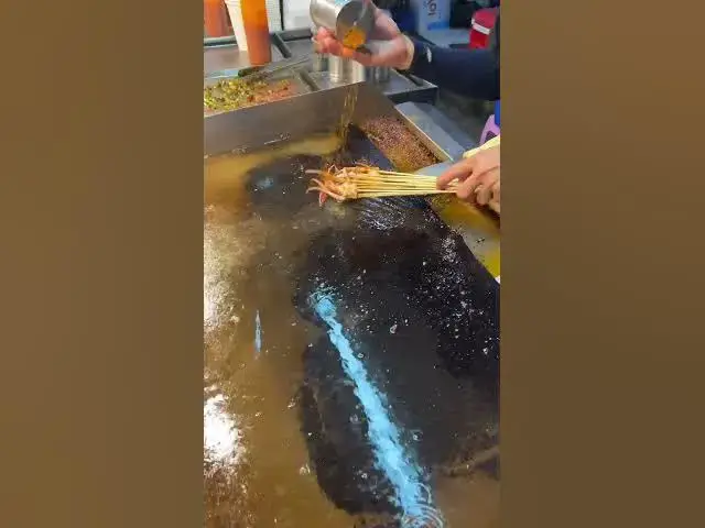 'Video thumbnail for Vietnam’s Spiciest Octopus Tentacles |  Râu bạch tuộc nướng siêu cay #streetfood #grilledoctopus'