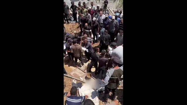 'Video thumbnail for Burial of 19 members of a Palestinian family killed in Israeli strikes'