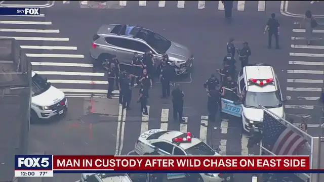 'Video thumbnail for Midtown Manhattan police chase ends with guns drawn'