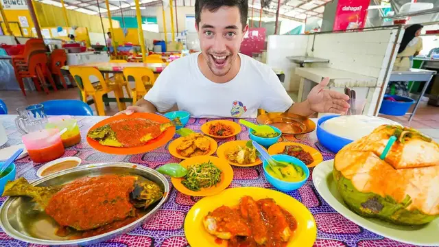 'Video thumbnail for Malaysian Street Food - Crab LOLLIPOPS + BBQ Seafood Feast (Ikan Bakar) in Borneo!'