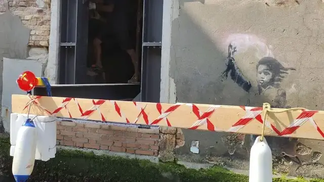 'Video thumbnail for Venice's Banksy mural 'Migrant Child' removed for renovation and restoration'