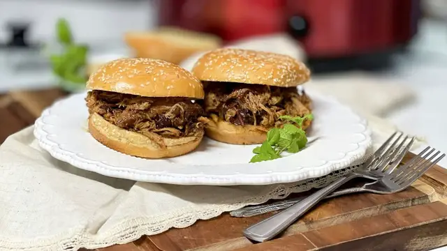'Video thumbnail for Slow Cooker Pulled Pork That's Sweet, Tangy, And Got A Kick'