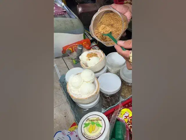 'Video thumbnail for Vietnam’s Famous Kem Dừa – Coconut Ice Cream in a Shell! 🇻🇳 #shorts #streetfood #icecream #vietnam'