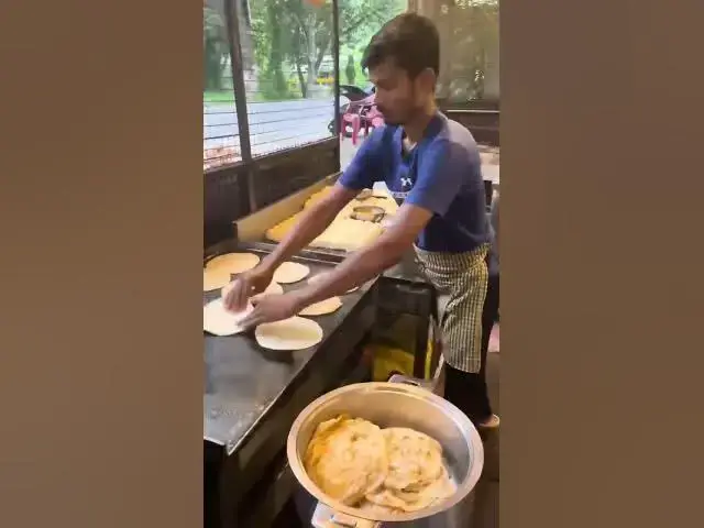 'Video thumbnail for Watch This Street Vendor Make Perfect Parotta! 😍✨ | Fluffy & Crispy Poratta'