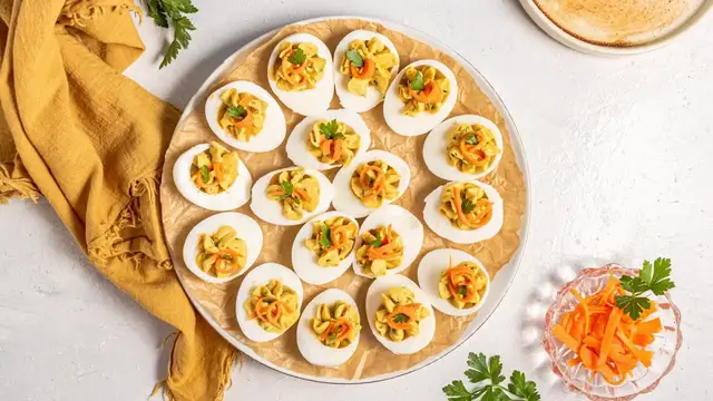 'Video thumbnail for Curried Deviled Eggs With Pickled Carrots Recipe'